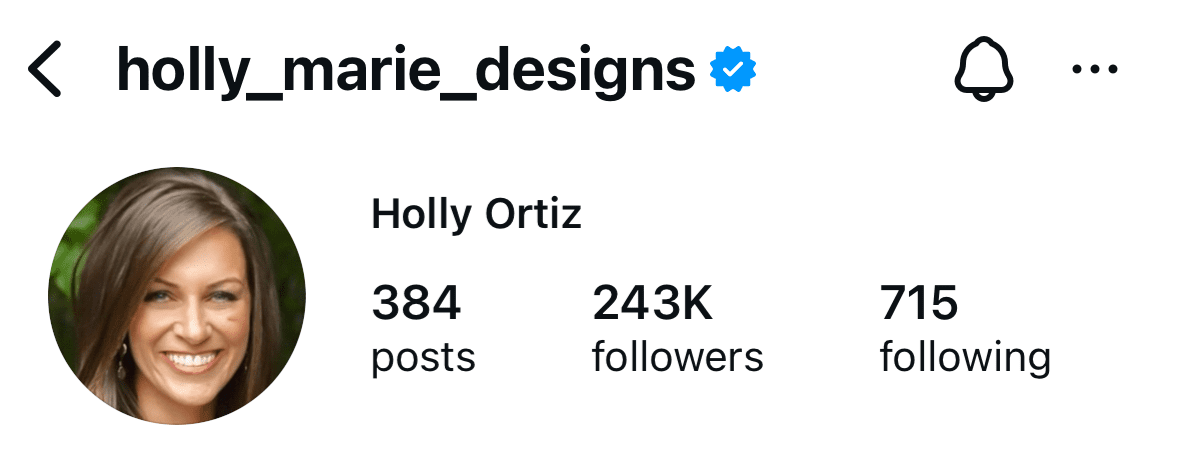 Instagram profile photo of Holly Ortiz from Holly Marie Designs — headshot outdoors with natural greenery in the background.